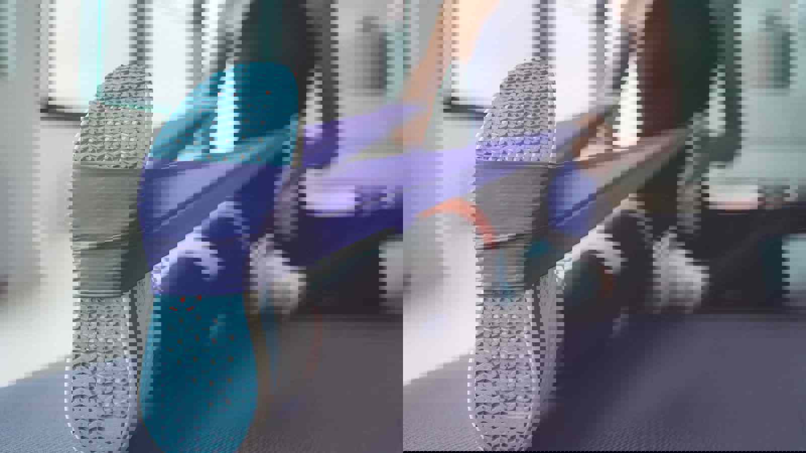 Person stretching using a dynaband