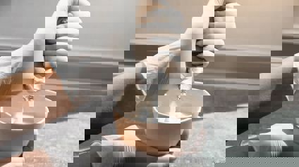 Hairdresser Mixing Colour In A Bowl