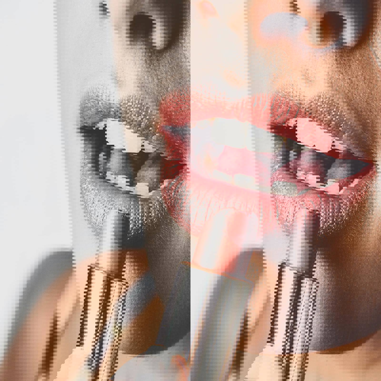 Woman applying lipstick