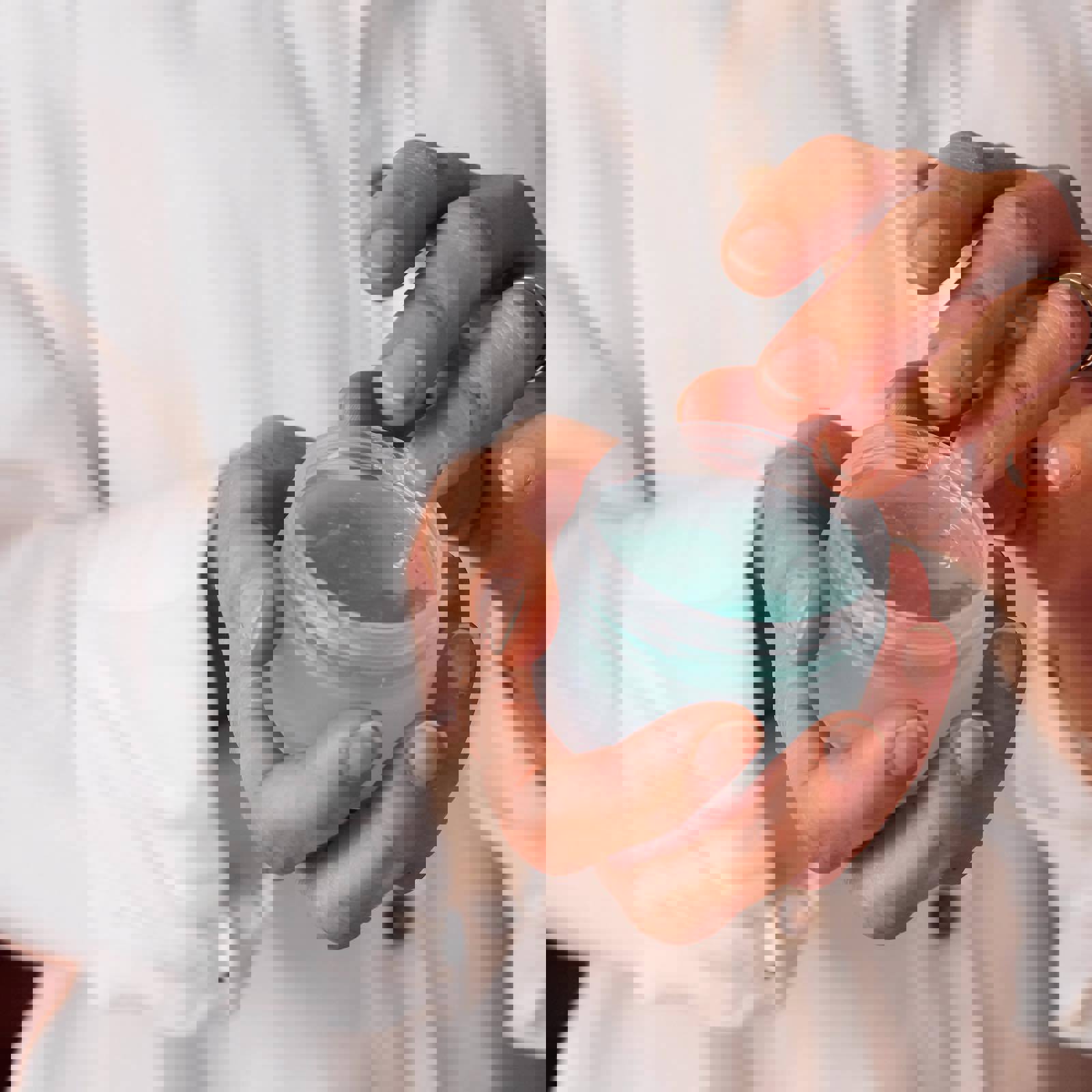 Person holding skincare product