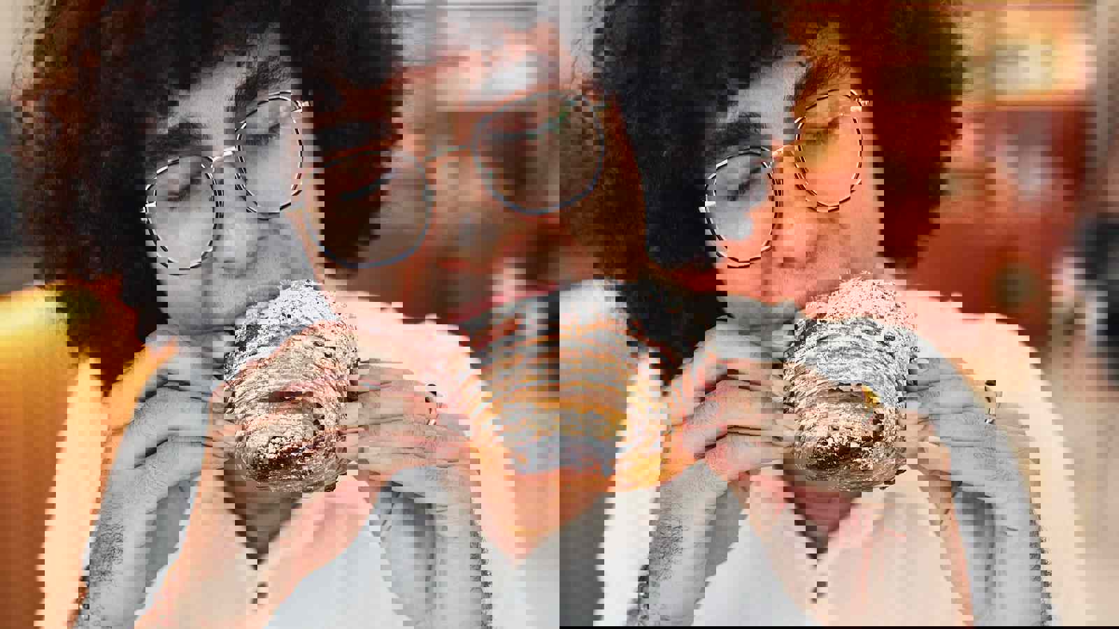 Person Eating Pain Au Chocolat