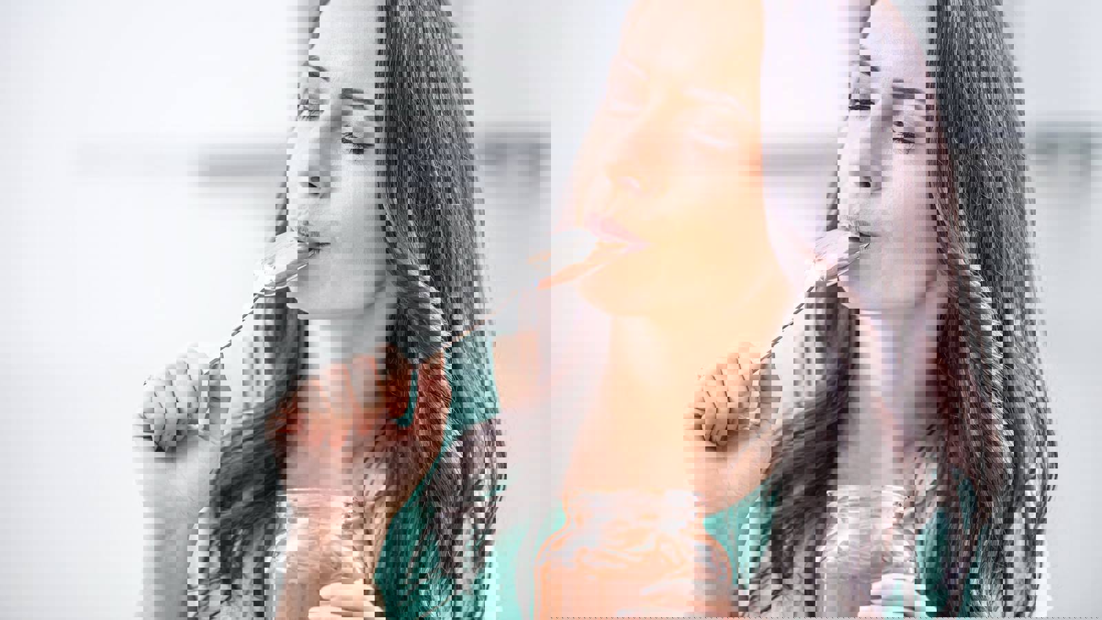 Person eating a chocolate dessert