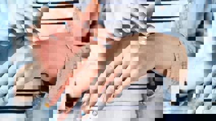 Female Hands Applying Hand Cream