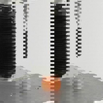 Hemispherical Probe attached to Texture Analyser testing cosmetic product