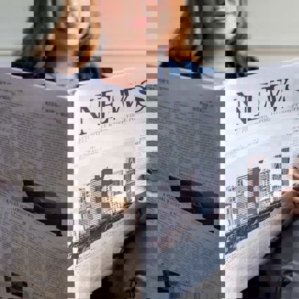 Person reading a newspaper