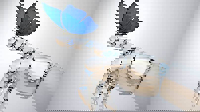 Blue Butterfly Sitting On Robotic Hand