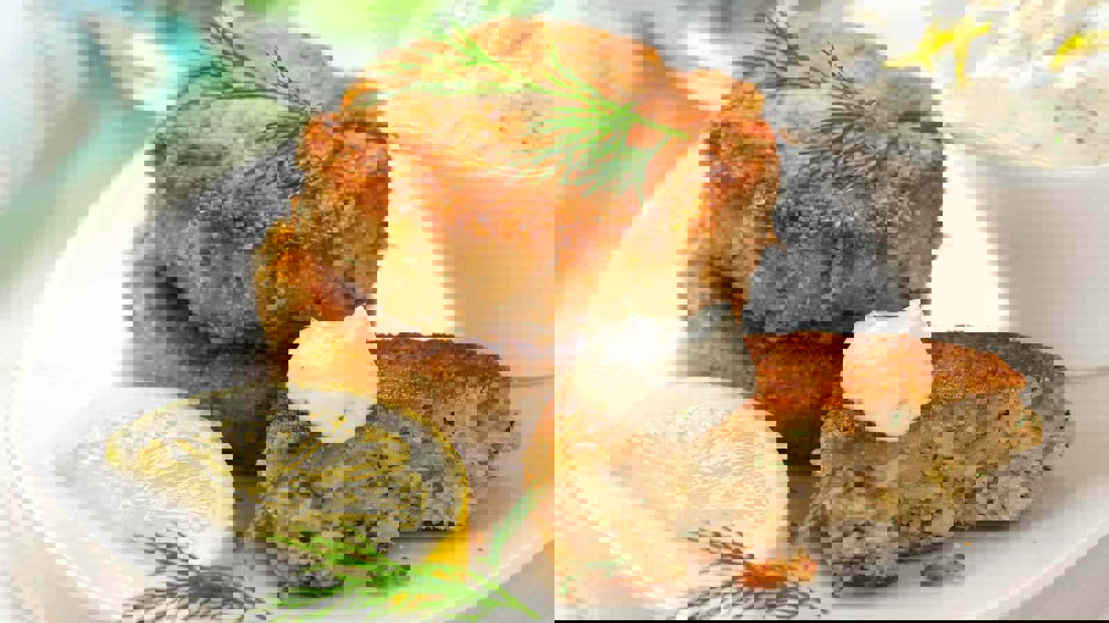 Fish cakes served with lemon and yoghurt dressing