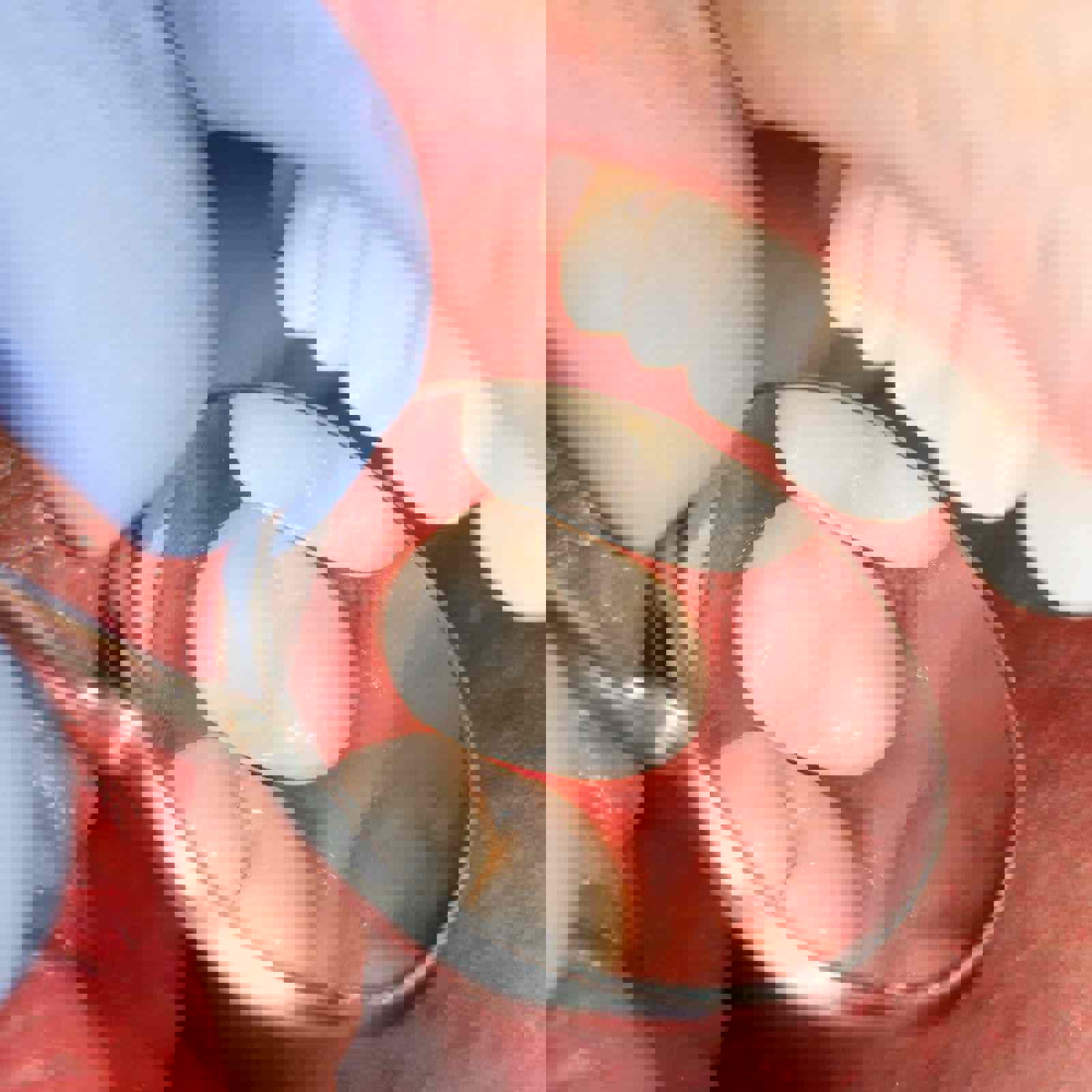 Dentist examining patients teeth with mirror