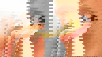 Woman Biting Crisp