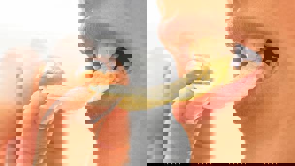 Woman Biting Crisp