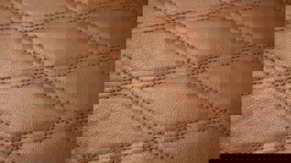 Close Up Of Diamond Pattern Stitching On Leather