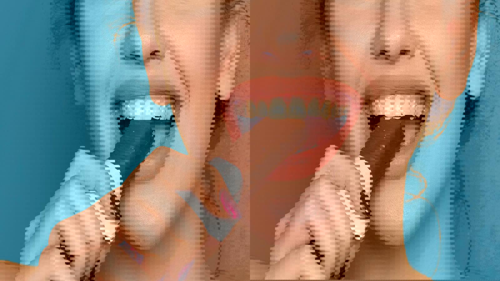 Woman Biting Into Chocolate Bar