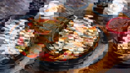 Plate Of Chicken Strips And Condiments