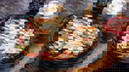 Plate Of Chicken Strips And Condiments