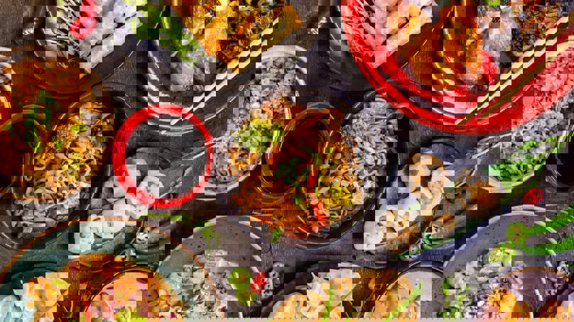 Table Filled With Delicious Asian Dishes