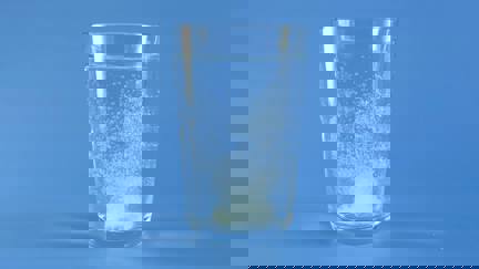 Glass Of Water With Effervescent Tablet Dissolving