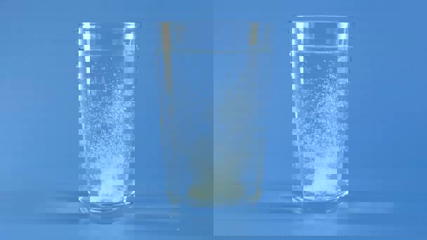 Glass Of Water With Effervescent Tablet Dissolving