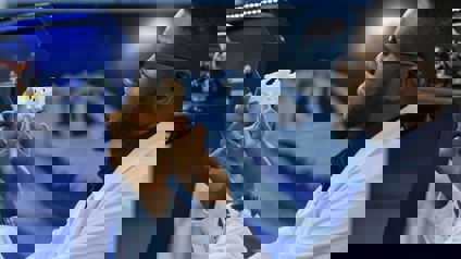 Researcher Examining 3D Printed Medical Component