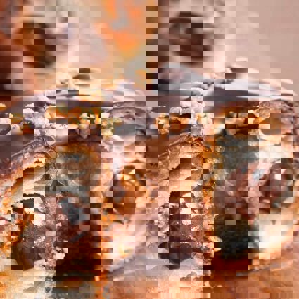 Cronut cut in half to reveal chocolate filling