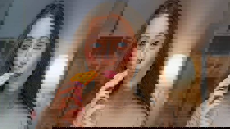 Woman Biting Into Cracker