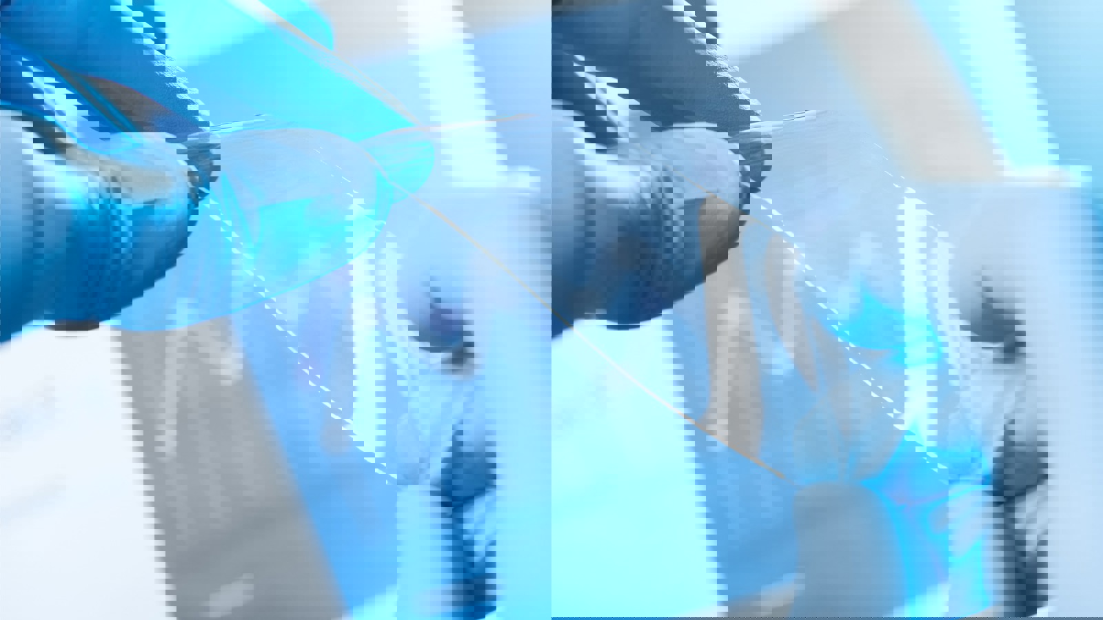 Person holding a piece of clear plastic