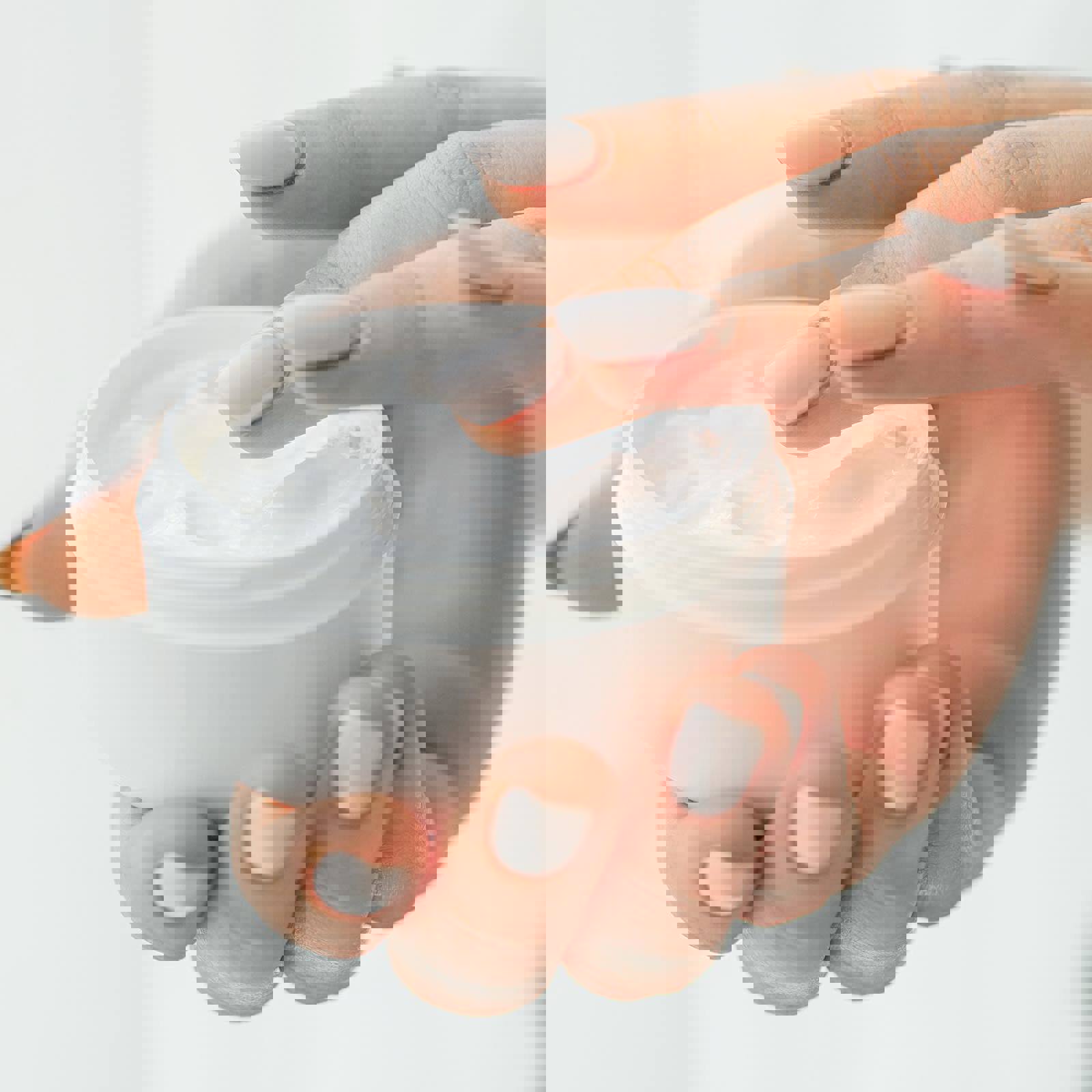 Person holding skincare product