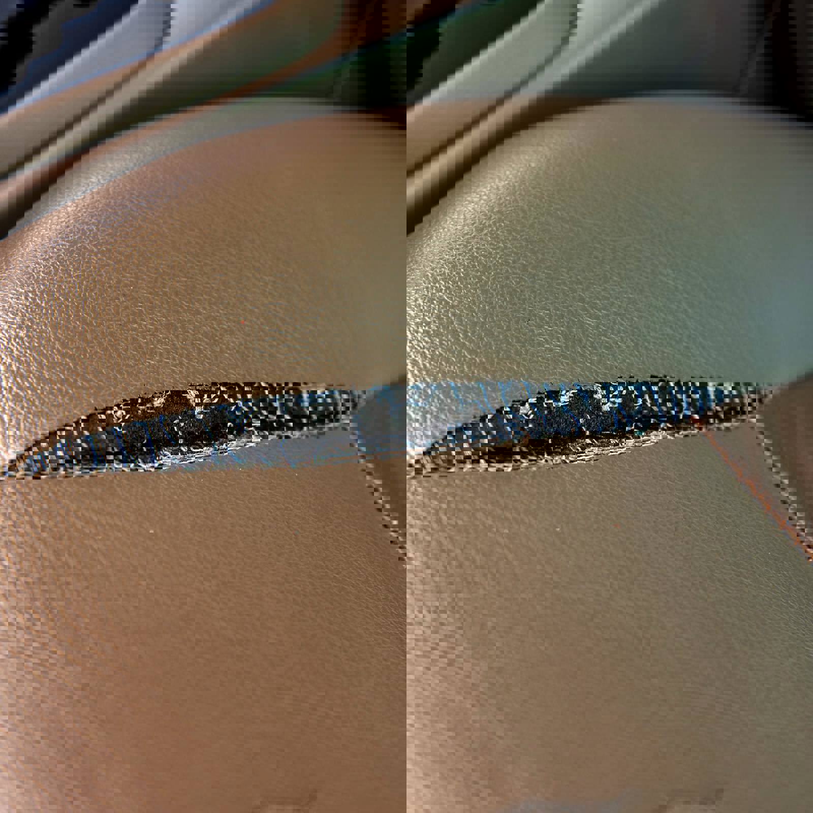 Torn leather car seat seam