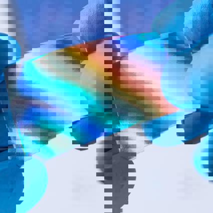 Person wearing gloves holding a reflective material