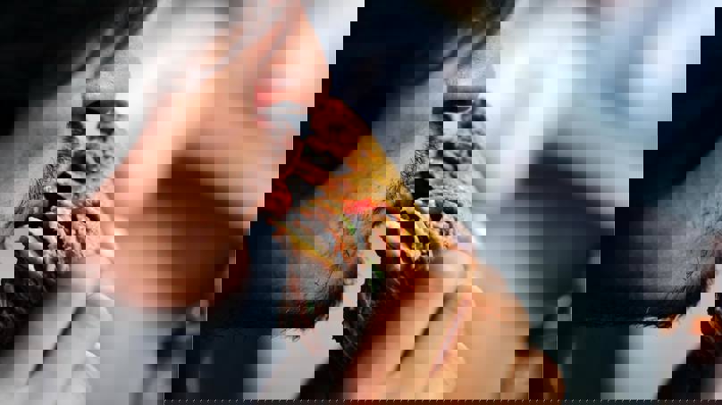 Man Taking A Big Bite