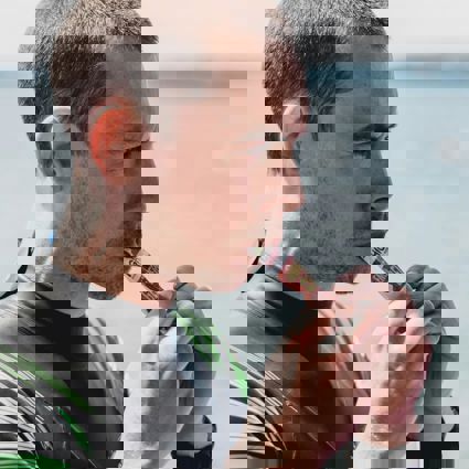 Surfer consuming an energy sachet