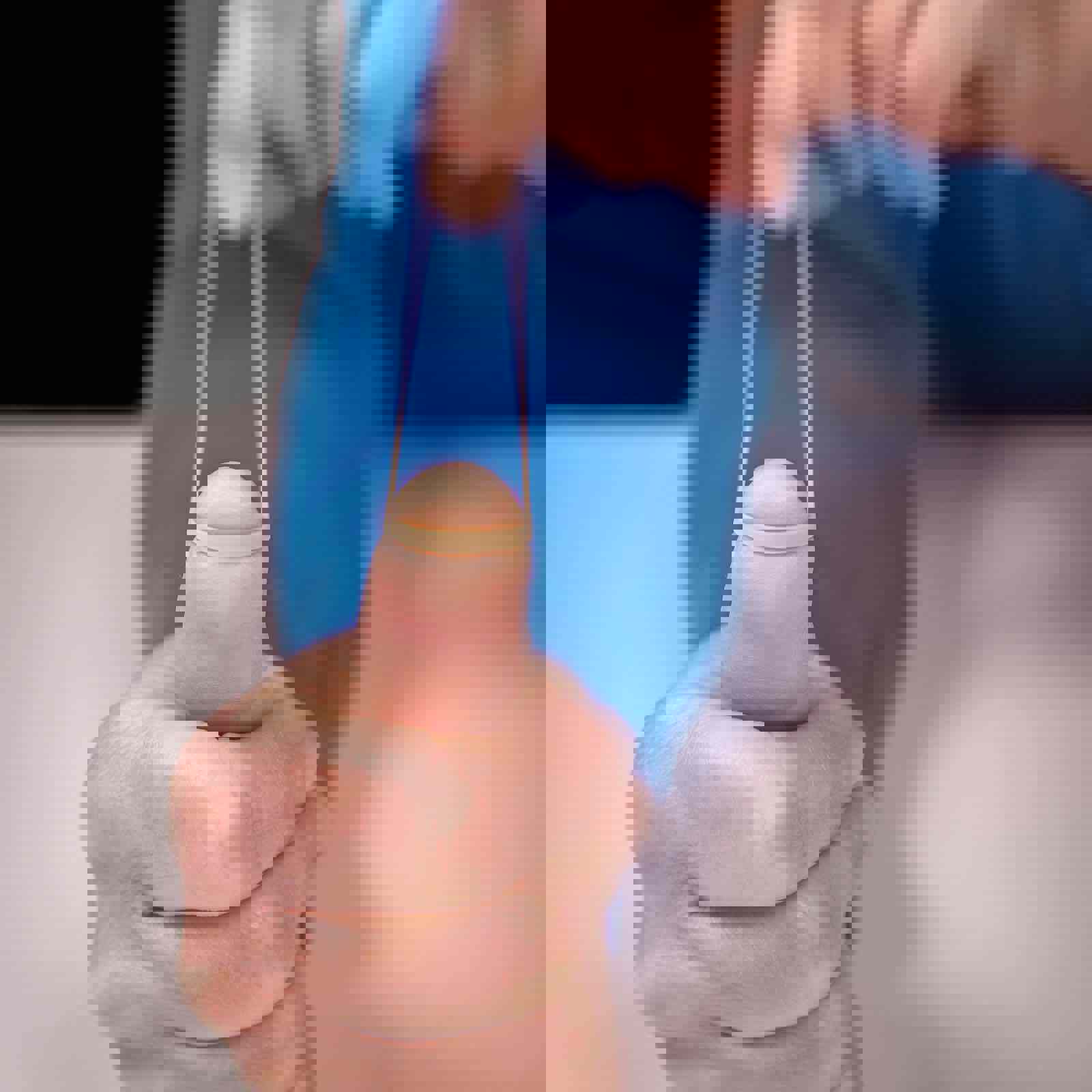 Person stretching a rubber band