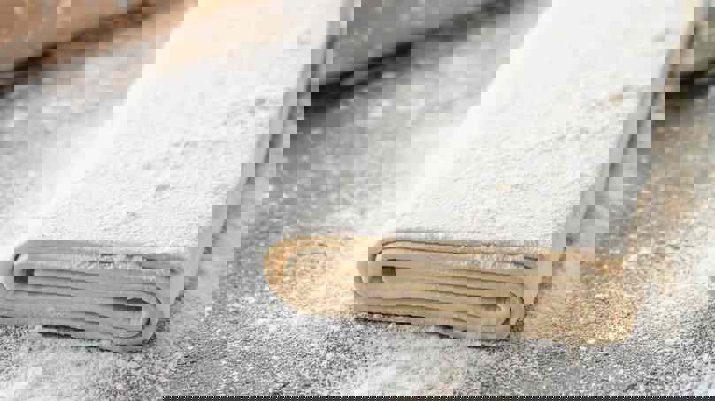 Raw Puff Pastry On Floured Surface