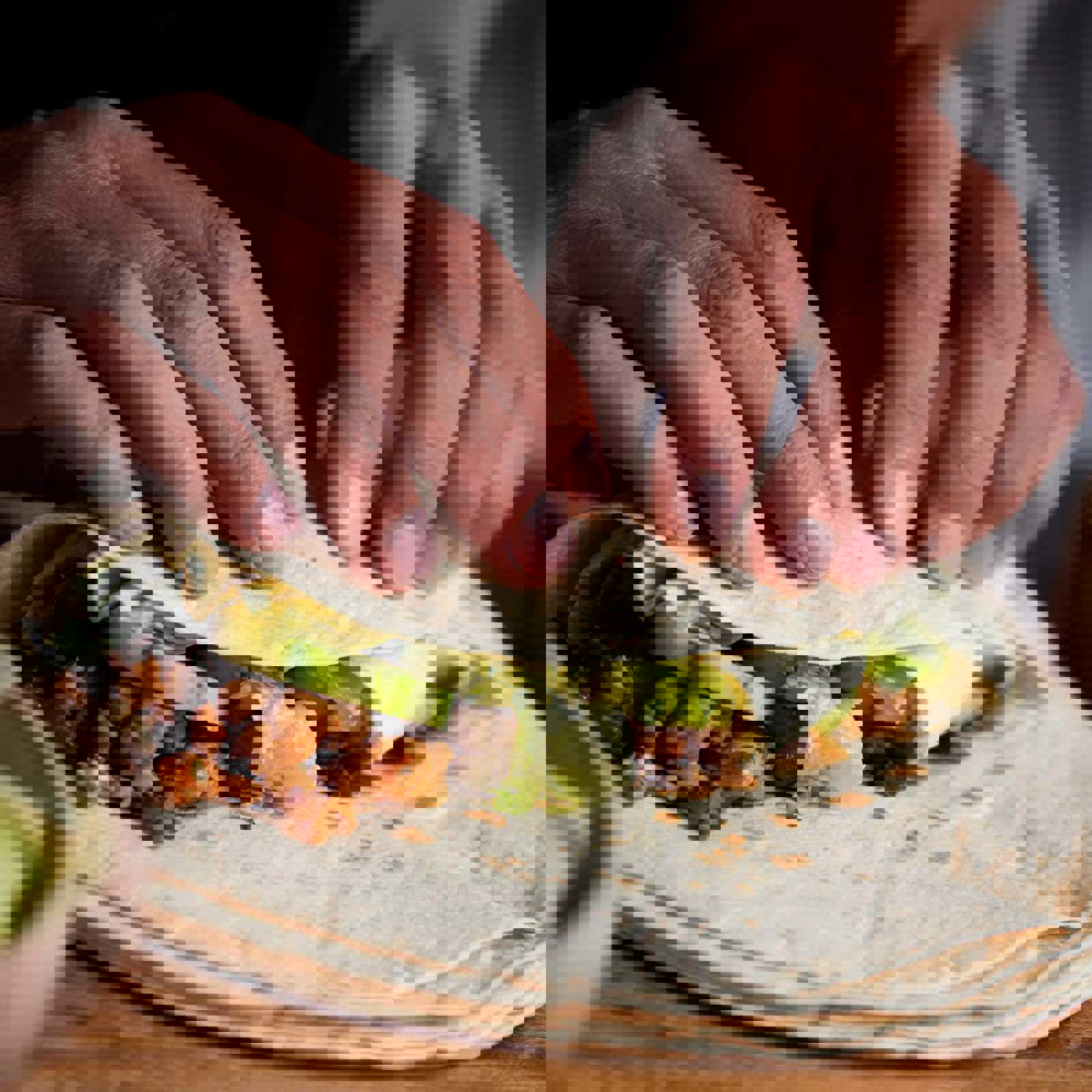 Person folding a tortilla wrap