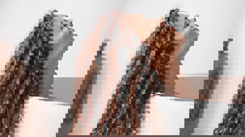 Person In Bath With Curly Hair