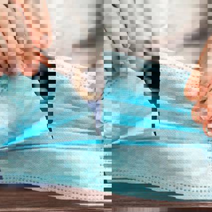 Person ripping fabric