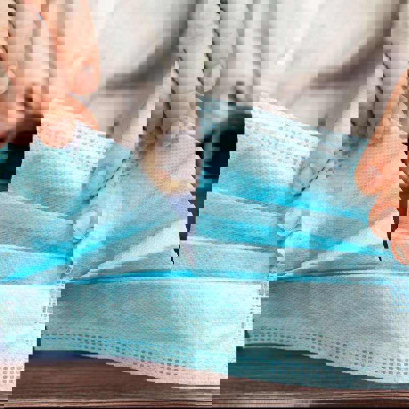 Person ripping fabric