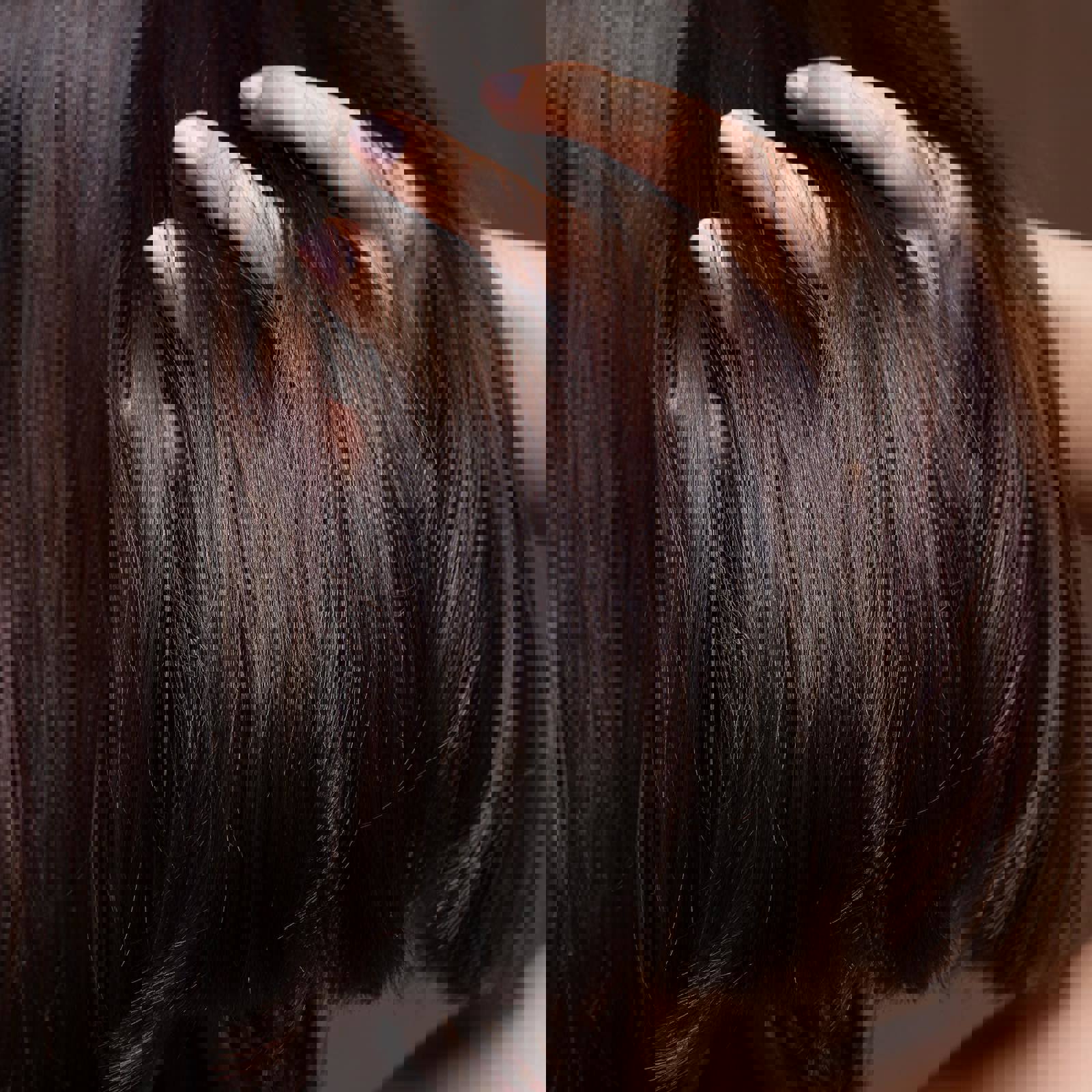 Person running fingers through shiny hair
