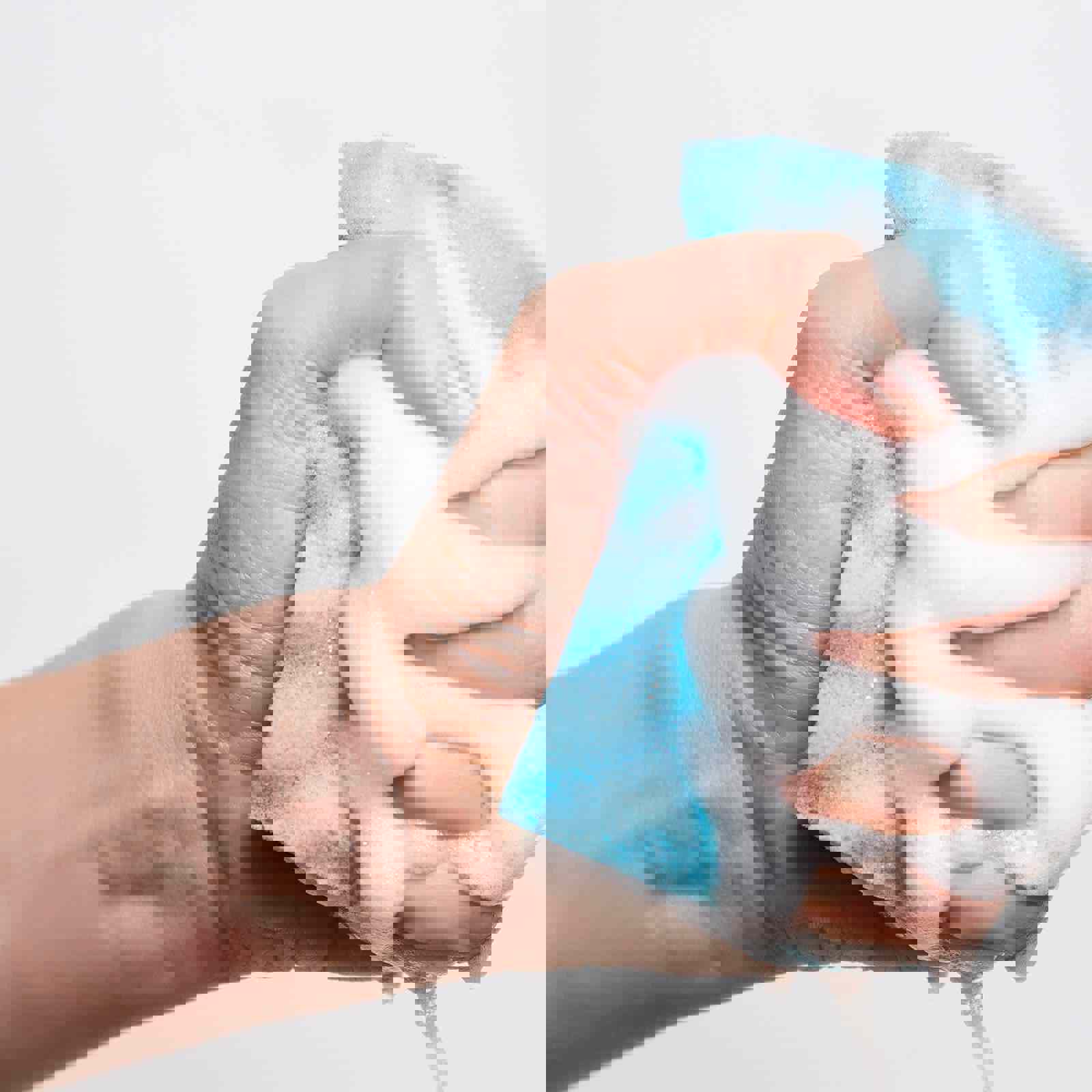 Person squeezing foam