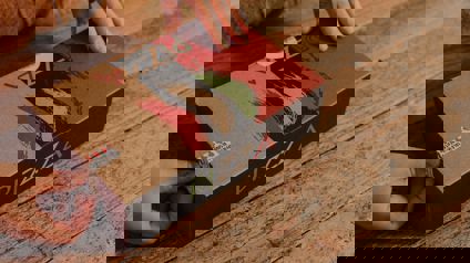 Hands Opening Cardboard Pizza Box