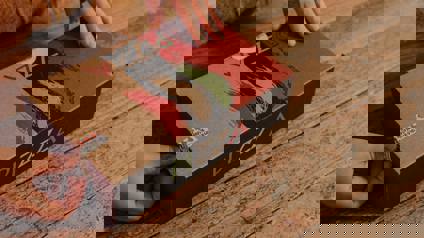 Hands Opening Cardboard Pizza Box